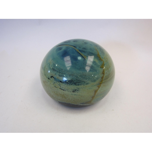 1365 - A Mdina style oversized glass paperweight, green tones, 8.5cm diameter