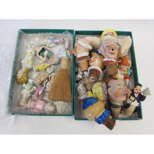 1377 - A selection of ceramic bottle stoppers, clay pipes and pin cushion dolls, etc