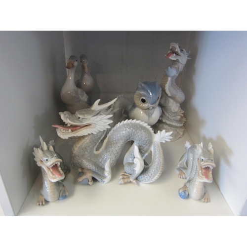 1406 - A collection of Lladro style figures, mostly dragons