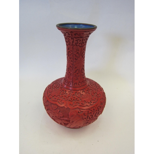 1417 - A cinnabar style vase, 23.5cm tall