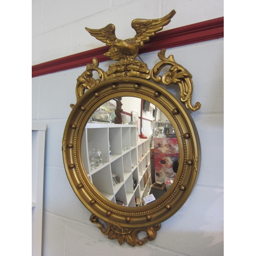 1421 - A Regency style gilt gesso wall mirror, the top surmounted by an eagle, 80cm tall total