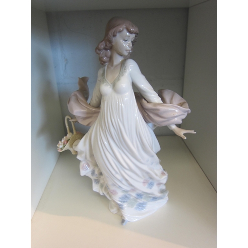 1427 - A Lladro figure of girl wearing shawl holding basket of flowers, boxed, 29.5cm tall