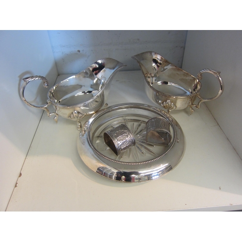 1428 - A matched pair of plated sauce boats, a shallow form plated and star cut dish, 18cm diameter and a p... 