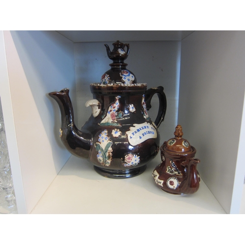 1435 - A Bargeware teapot of large proportions 31cm tall, together with a miniature Bargeware teapot