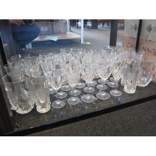 1493 - An extensive suite of crystal drinking glasses, champagne, tumblers, wine in two sizes and matching ... 