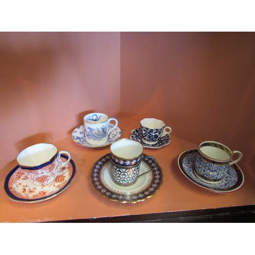 1077 - Nine coffee cans (mainly Imari palette) to include a silver cased Aynsley example, Royal Crown Derby... 