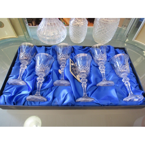 1179 - A boxed set of six Bohemia crystal wine glasses, three glass decanters and various glass picture hol... 