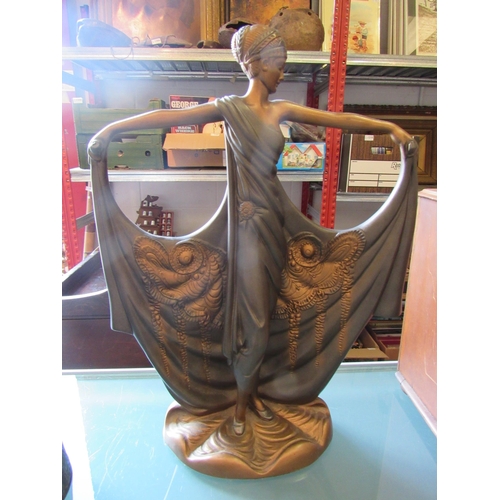 1187 - An Art Deco style bronzed resin sculpture of a woman in dress, arms outstretched, 38.5cm high
(R) £2... 