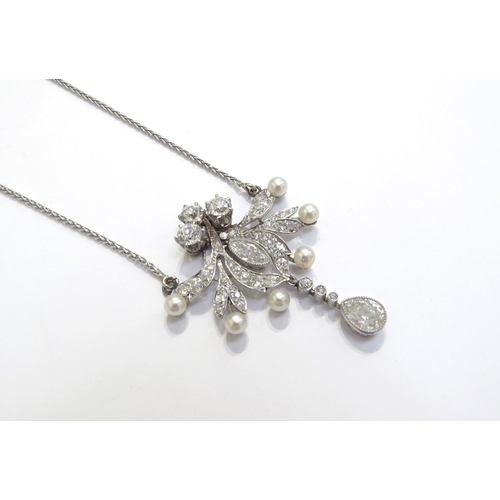 7031 - An early 20th Century diamond and pearl cluster pendant necklace with pear cut diamond droplet 0.50c... 