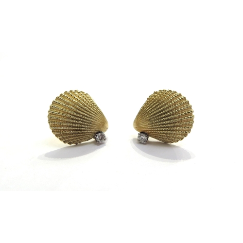 7392 - A pair of Tiffany and Co yellow gold earrings as shells with a single brilliant cut diamond to each,... 