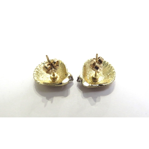 7392 - A pair of Tiffany and Co yellow gold earrings as shells with a single brilliant cut diamond to each,... 