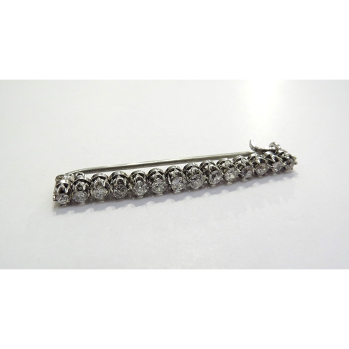 7393 - An Edwardian diamond bar brooch, fourteen old mine cut diamonds, 1.12ct total approx, in white gold ... 