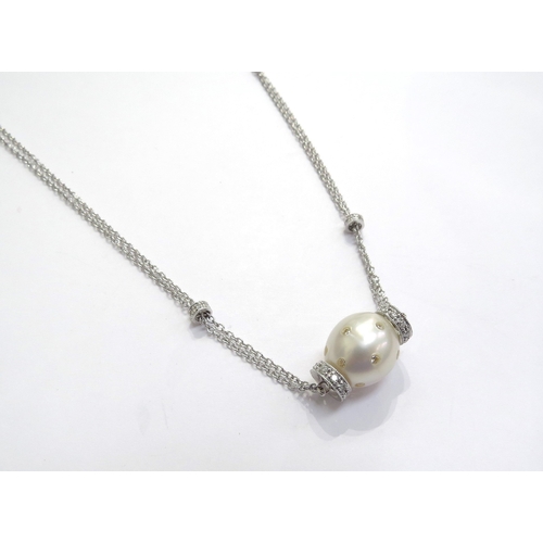 7402 - A white gold double trace chain link necklace with cultured pearl studded with diamonds and diamond ... 