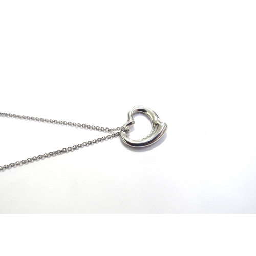 7400 - A Tiffany and Co Elsa Peretti open heart pendant in platinum with diamonds, hung on chain marked 950... 