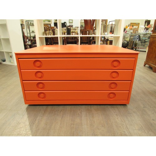 2278 - An orange painted four drawer Plan chest in Beech ply, with inset handles and set of four castors. 1... 