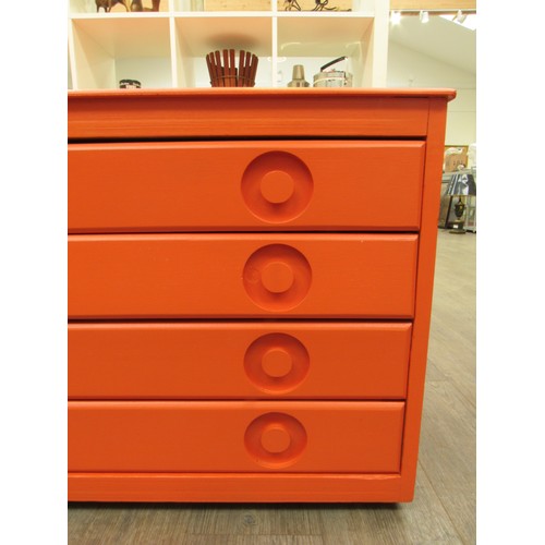 2278 - An orange painted four drawer Plan chest in Beech ply, with inset handles and set of four castors. 1... 