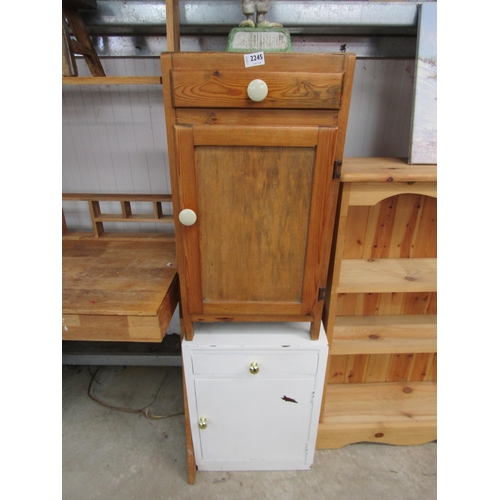 2245 - A pine bedside cabinet single drawer with door and a similar example painted white (2)