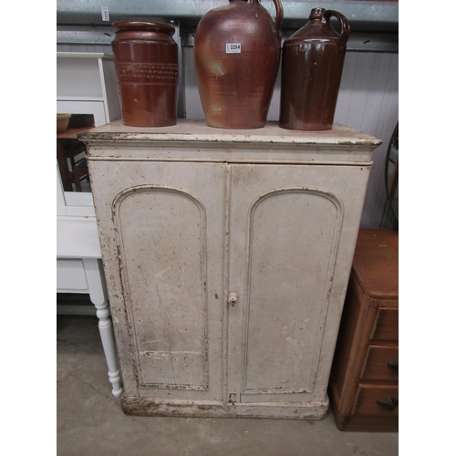 2255 - A Victorian painted pine cupboard, twin arch top door