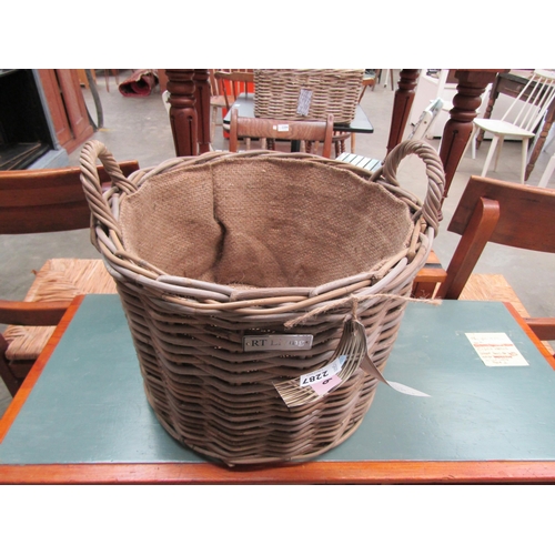 2287 - A hessian lined twin handled wicker basket, 38cm diameter