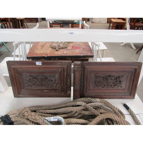 2298 - A pair of 19th Century carved walnut panels with dragon head design