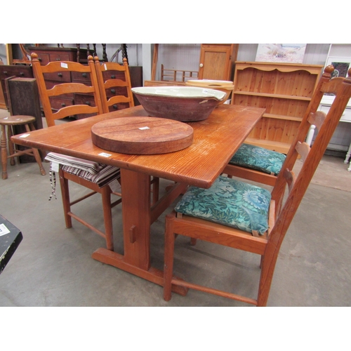 2300 - A pine trestle table and four chairs