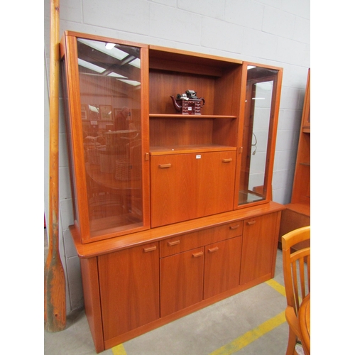 2301 - A 1970's teak display unit with drinks cabinet centre        (E) £10-15