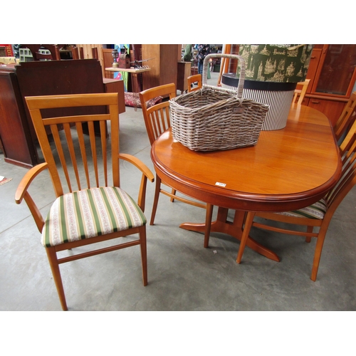 2317 - A teak extending dining table and six chair frames