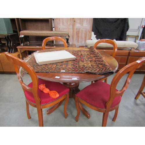 2321 - A circular dining table and four chairs