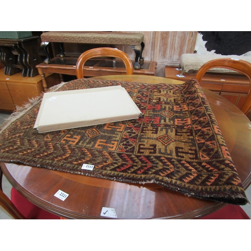 2322 - An middle eastern style wool rug. 88x123 cm       (R) £35