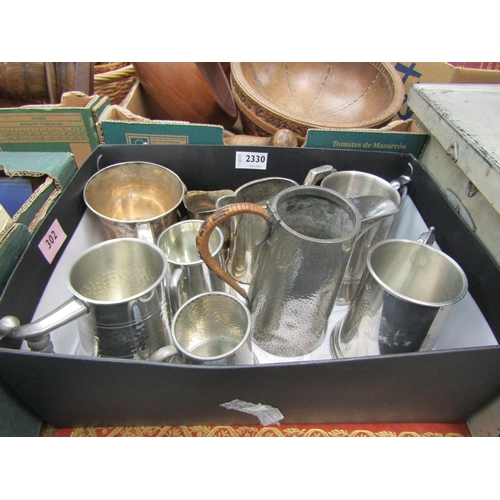 2330 - A box of tankards, one containing coins