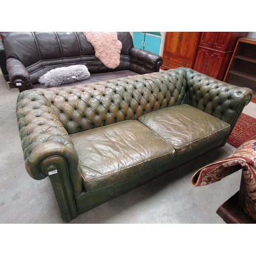 2386 - A green button leather two seater pub sofa, 105cm x 240cm