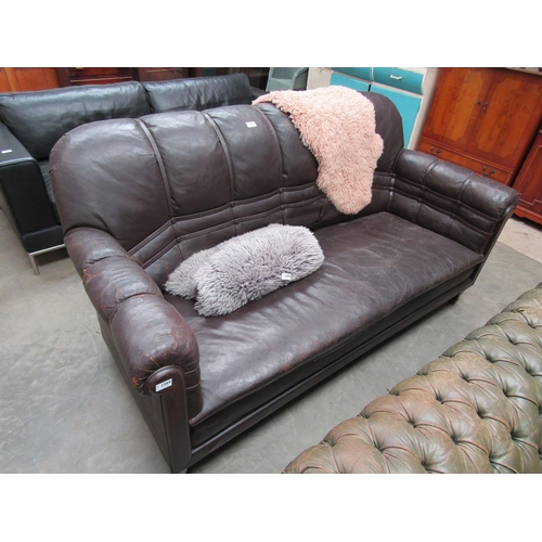 2389 - An Art Deco brown button leather sofa on mahogany square tapering legs         (C)