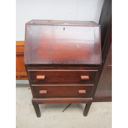 2394 - A 1920's oak bureau, fall front over two long drawers