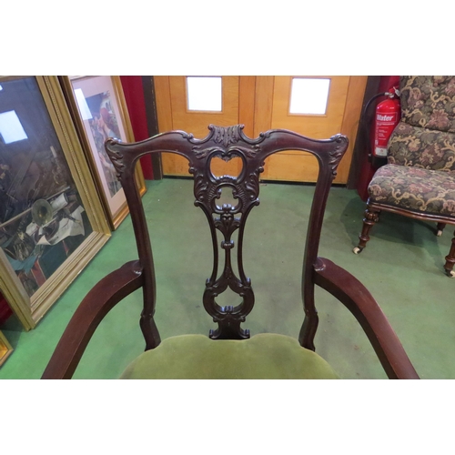 4066 - A late Victorian mahogany armchair, the carved and fretwork backrest, acanthus leaf carved armrests ... 