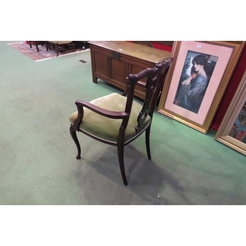 4066 - A late Victorian mahogany armchair, the carved and fretwork backrest, acanthus leaf carved armrests ... 