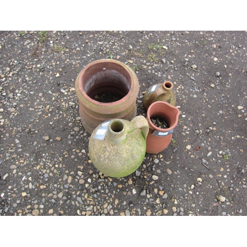 3531 - A terracotta chimney pot, a jug and two olive jugs