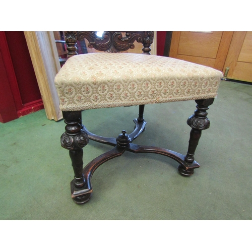 4013 - An 18th Century revival carved oak back rest chair on carved and turned fore legs united by an 