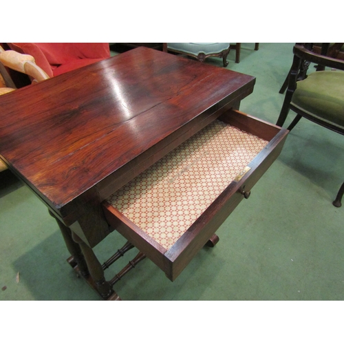 4065 - A Circa 1840 rosewood games/work table, the fold over swivel top with inlaid backgammon/chess and cr... 