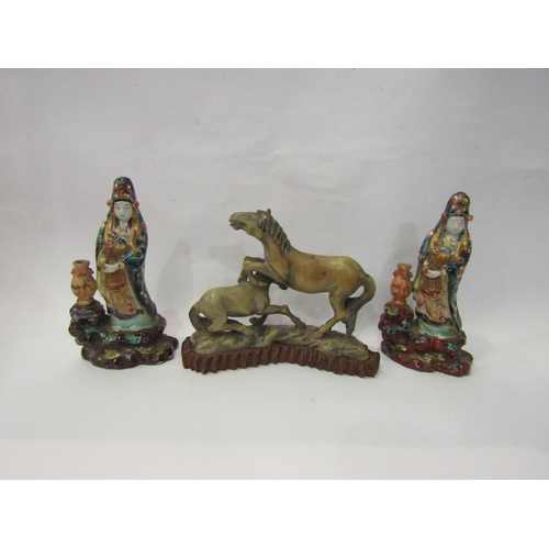 4084 - A pair of Oriental porcelain figures, 16cm tall, one a/f, and a carved stone Chinese horse group on ... 