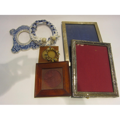 4450 - Seven 1920's and earlier photo frames including two hallmarked silver