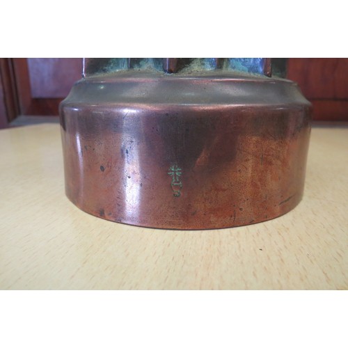 1131 - A box of metal ware to include a 19th Century copper jelly mould. (Part lot in cabinet)