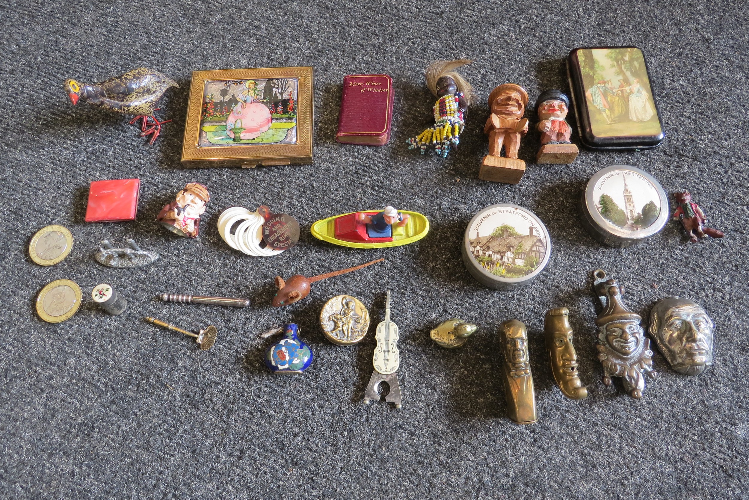 A box containing miscellaneous curios including penknives, thimbles