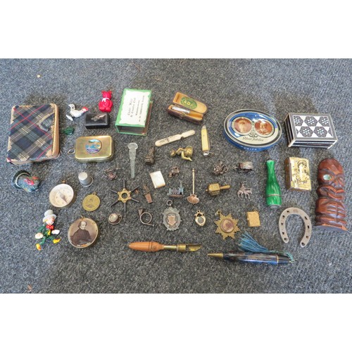 A box containing miscellaneous curios including penknives, thimbles
