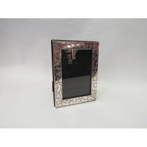 4063 - A Middle Eastern silver photograph frame with modernist design, stamped 925, 15.5cm x 11.5cm