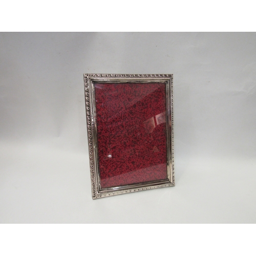 4085 - A Turkish silver photograph frame with leaf design relief, 24cm x 18cm, with original box   (R) £30