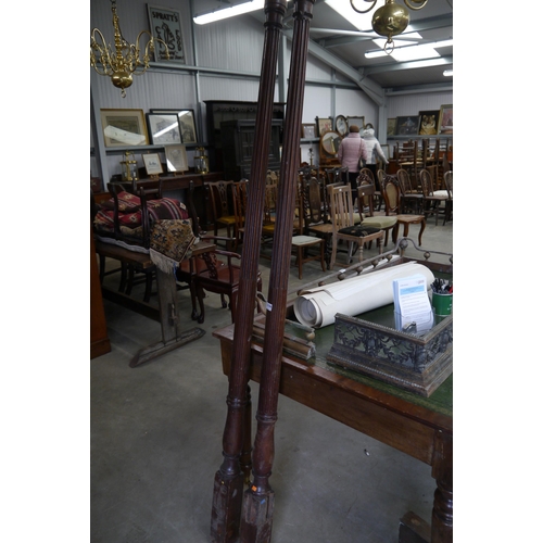 2104 - A pair of 19th Century mahogany reeded bed posts