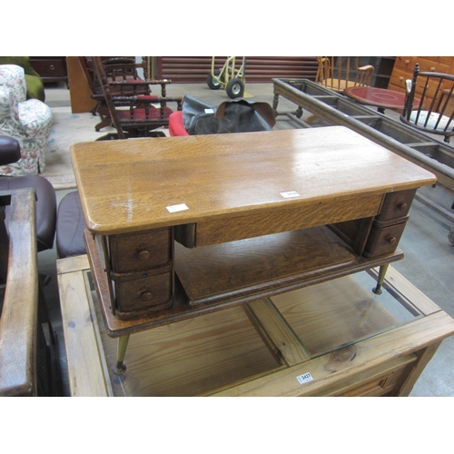 2436 - A Singer sewing machine table converted into a coffee table / television stand, 1960's pin legs