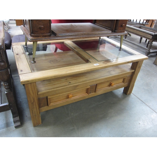 2437 - A Mexican style two tier coffee table with glass inserts