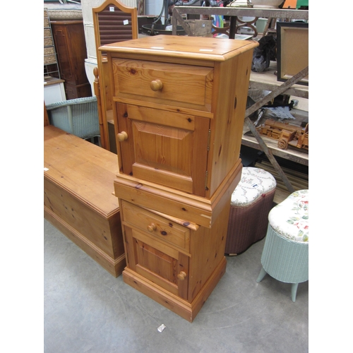 2443 - A pair of modern pine bedside cabinets, single drawers over single cupboard doors, plinth base