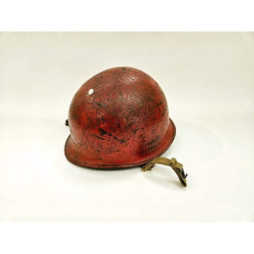 8112 - A post-war US helmet with liner, re-painted in red